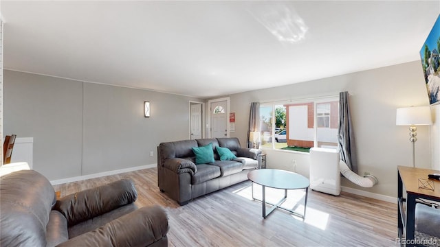 living room with light hardwood / wood-style floors