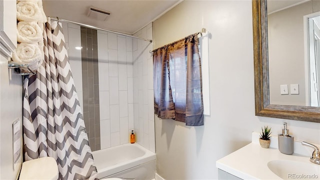 full bathroom featuring vanity, shower / tub combo with curtain, and toilet