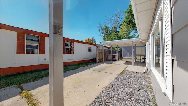 exterior space featuring a carport and a patio