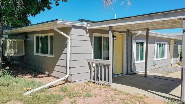 view of side of property featuring a patio area