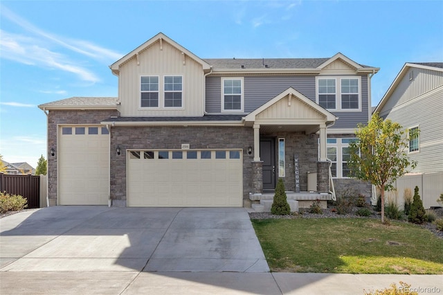 craftsman-style house with a front yard and a garage