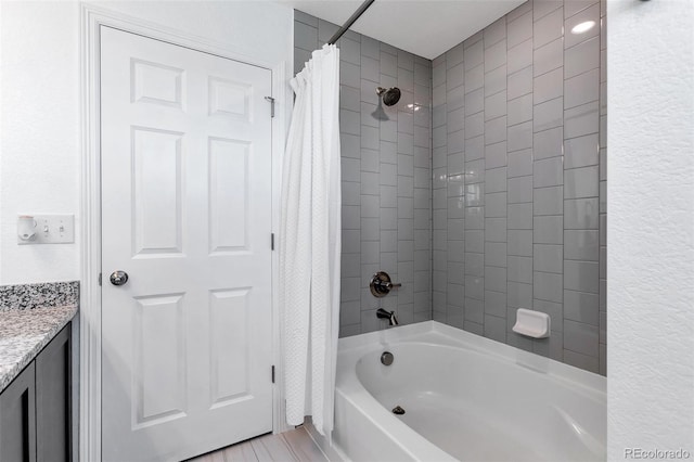 bathroom with vanity and shower / bath combination with curtain