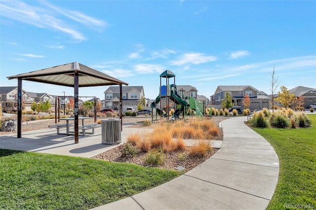 view of property's community with a yard and a playground