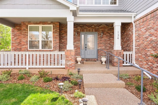 entrance to property with brick siding