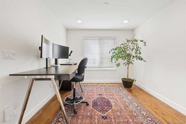 home office featuring baseboards, recessed lighting, and wood finished floors