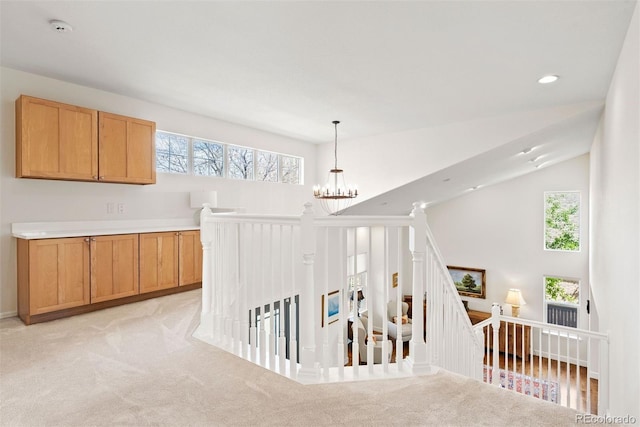 interior space featuring an inviting chandelier, carpet, recessed lighting, and a wealth of natural light