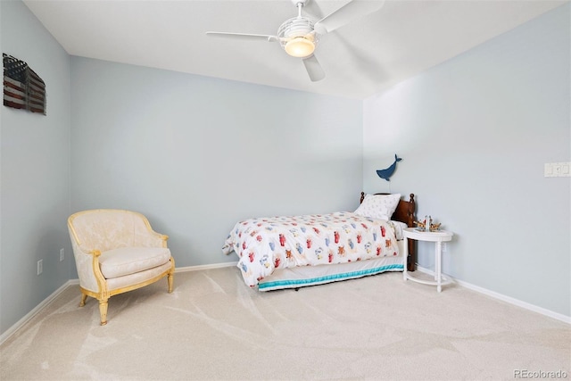 carpeted bedroom with baseboards and a ceiling fan