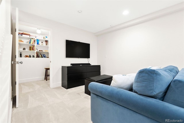 living room with baseboards and light carpet