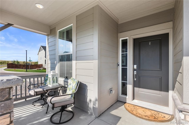 doorway to property with covered porch