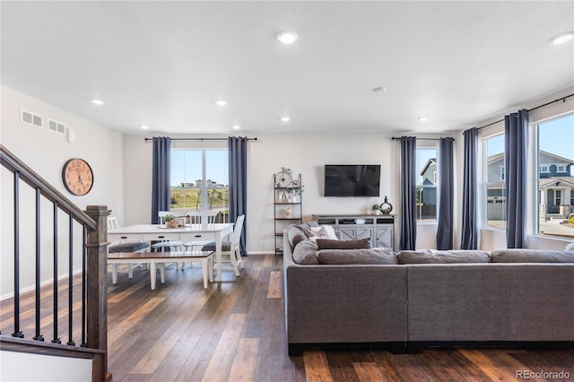 living room with dark hardwood / wood-style floors