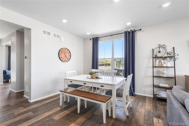 dining area featuring dark hardwood / wood-style flooring