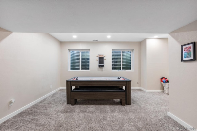 rec room with light carpet