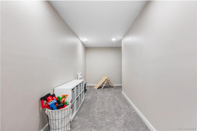 rec room with light colored carpet