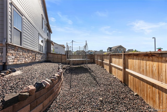 view of yard featuring a trampoline