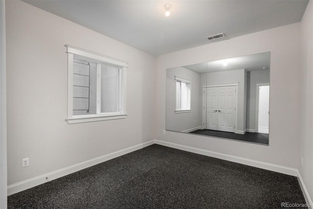 10252 E 58th Ave, Denver, CO 80238 - unfurnished room featuring baseboards