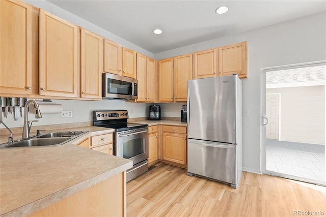 15612 E 96th Way Unit 21D, Commerce City, CO 80022 - kitchen with light countertops, light brown cabinets, appliances with stainless steel finishes, and a sink