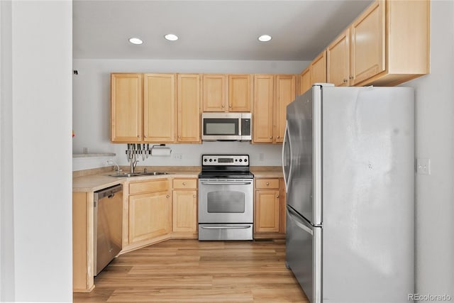 15612 E 96th Way Unit 21D, Commerce City, CO 80022 - kitchen featuring stainless steel appliances, light brown cabinets, and a sink