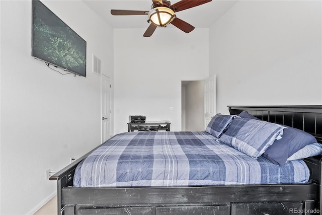 15612 E 96th Way Unit 21D, Commerce City, CO 80022 - carpeted bedroom featuring a ceiling fan, visible vents, and a towering ceiling
