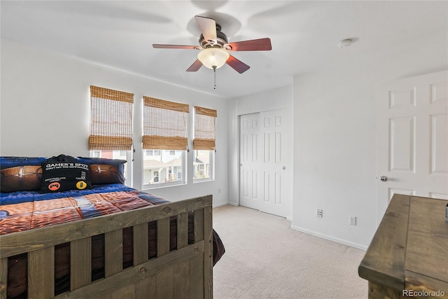 15612 E 96th Way Unit 21D, Commerce City, CO 80022 - bedroom featuring ceiling fan, light carpet, baseboards, and a closet