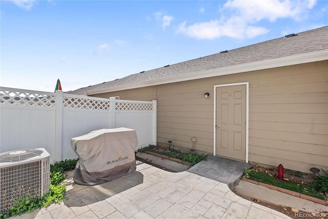 15612 E 96th Way Unit 21D, Commerce City, CO 80022 - view of patio / terrace featuring fence and cooling unit