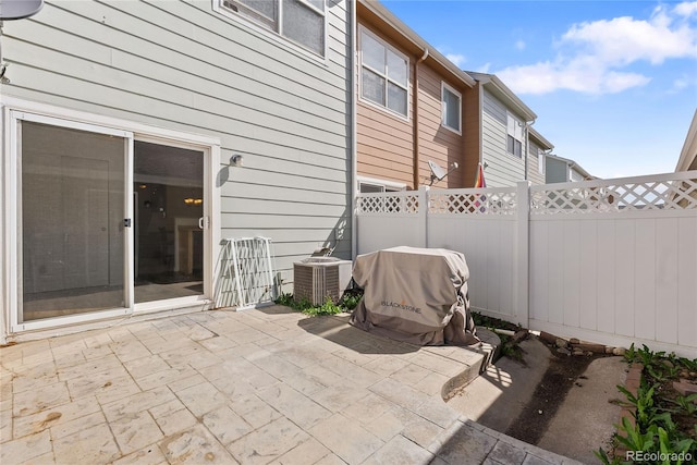 15612 E 96th Way Unit 21D, Commerce City, CO 80022 - view of patio featuring central AC, area for grilling, and fence