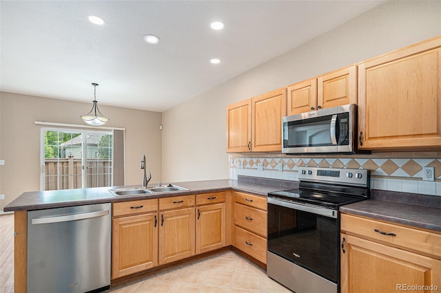 11862 W Stanford Pl, Morrison, CO 80465 - kitchen with appliances with stainless steel finishes, a sink, a peninsula, dark countertops, and recessed lighting