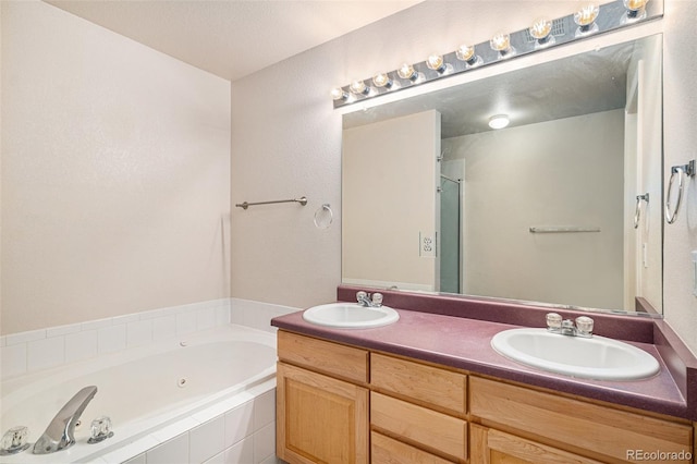 11862 W Stanford Pl, Morrison, CO 80465 - bathroom featuring a whirlpool tub, double vanity, and a shower with shower door