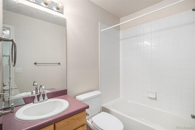 11862 W Stanford Pl, Morrison, CO 80465 - bathroom with toilet, vanity,  shower combination, and a textured wall