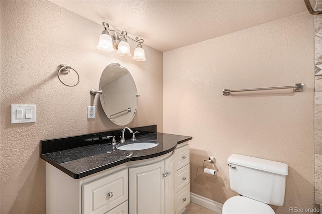 11862 W Stanford Pl, Morrison, CO 80465 - bathroom featuring vanity, toilet, a textured ceiling, and tile patterned floors