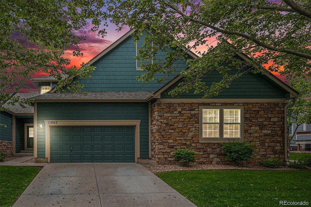 11862 W Stanford Pl, Morrison, CO 80465 - craftsman inspired home with stone siding, driveway, and a front lawn