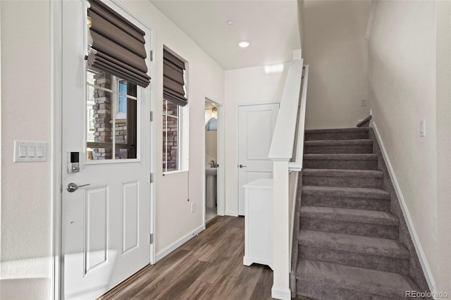 stairway featuring hardwood / wood-style flooring