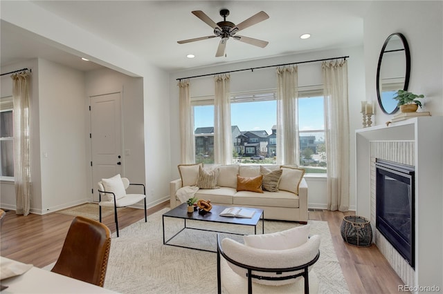 16550 Umatilla Pl, Broomfield, CO 80023 - living room featuring plenty of natural light, light wood-style flooring, baseboards, and recessed lighting