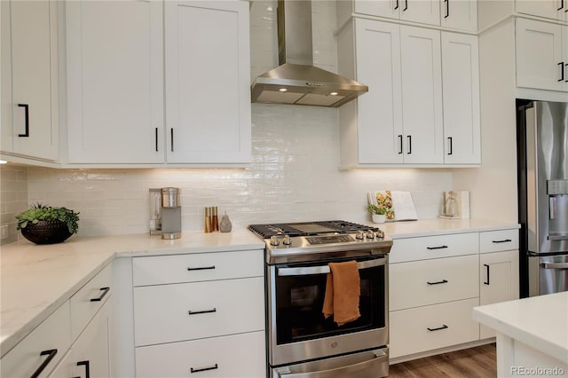 16550 Umatilla Pl, Broomfield, CO 80023 - kitchen with stainless steel appliances, wall chimney range hood, backsplash, and white cabinetry
