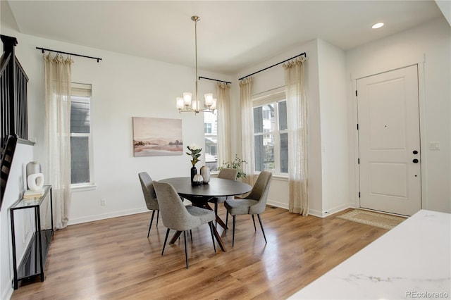 16550 Umatilla Pl, Broomfield, CO 80023 - dining space featuring a chandelier, light wood-style flooring, baseboards, and recessed lighting