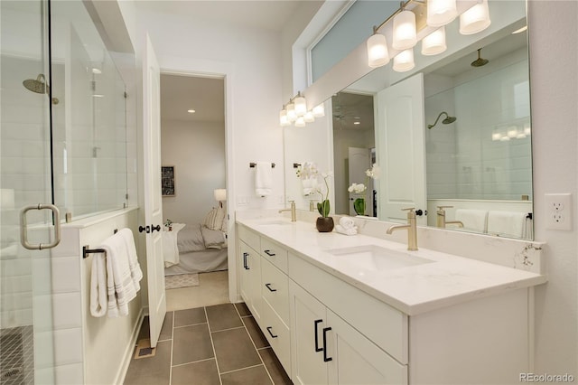 16550 Umatilla Pl, Broomfield, CO 80023 - ensuite bathroom with a shower stall, tile patterned flooring, and double vanity