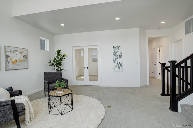 16550 Umatilla Pl, Broomfield, CO 80023 - living area with light colored carpet, french doors, recessed lighting, and baseboards