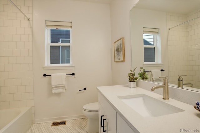 16550 Umatilla Pl, Broomfield, CO 80023 - bathroom with tile patterned floors, toilet, baseboards, vanity, and tub / shower combination