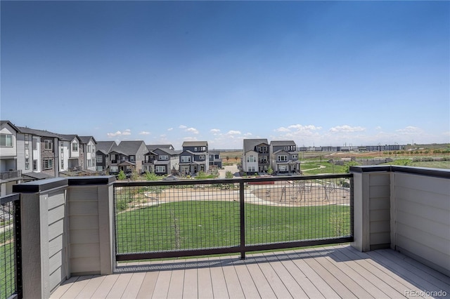 16550 Umatilla Pl, Broomfield, CO 80023 - deck featuring a residential view and a lawn