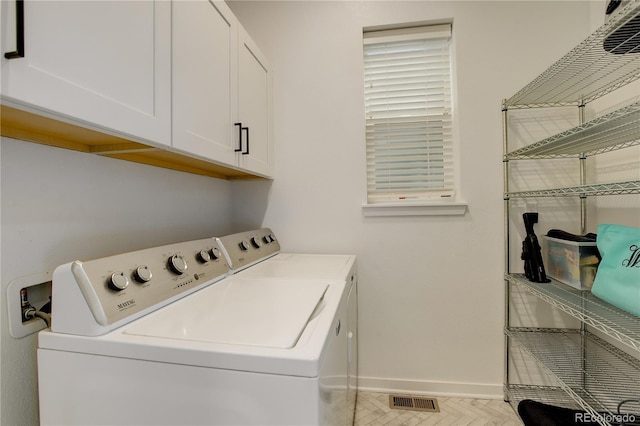 16550 Umatilla Pl, Broomfield, CO 80023 - clothes washing area with washer and clothes dryer, baseboards, and cabinet space