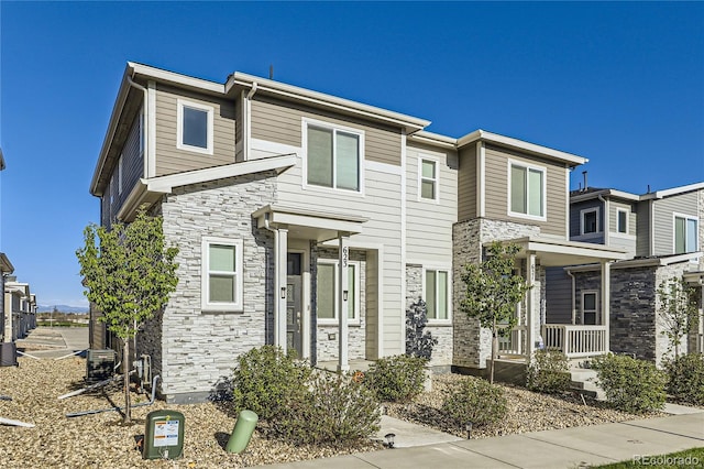 623 S Pitkin Ct, Aurora, CO 80017 - multi unit property featuring stone siding and a porch