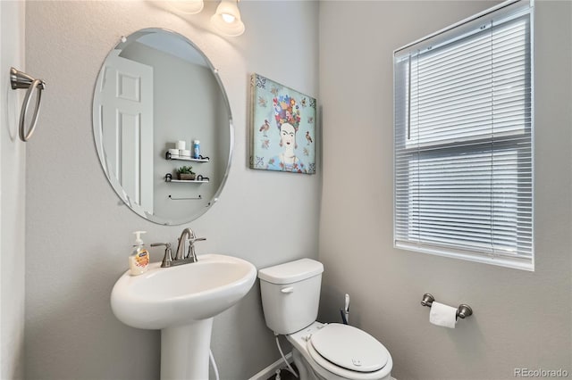 623 S Pitkin Ct, Aurora, CO 80017 - half bathroom featuring a sink and toilet