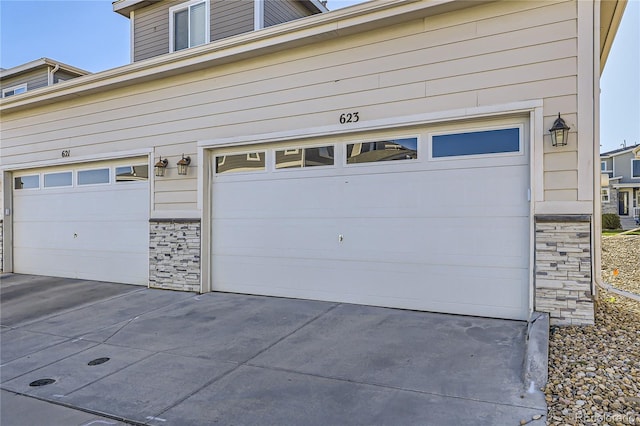 623 S Pitkin Ct, Aurora, CO 80017 - garage with concrete driveway
