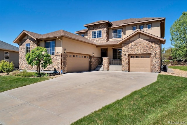 view of front of house with a front yard and a garage