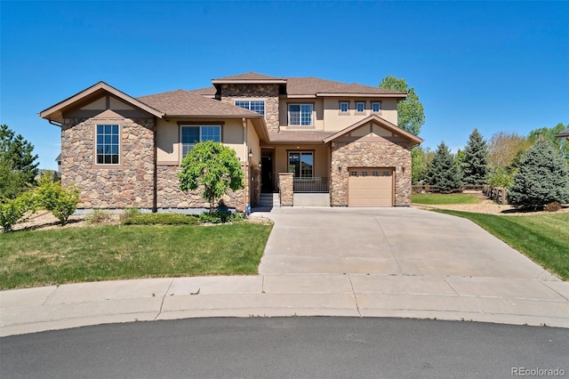 view of front facade with a garage and a front lawn