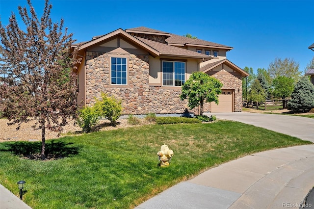 view of front of property with a front yard and a garage