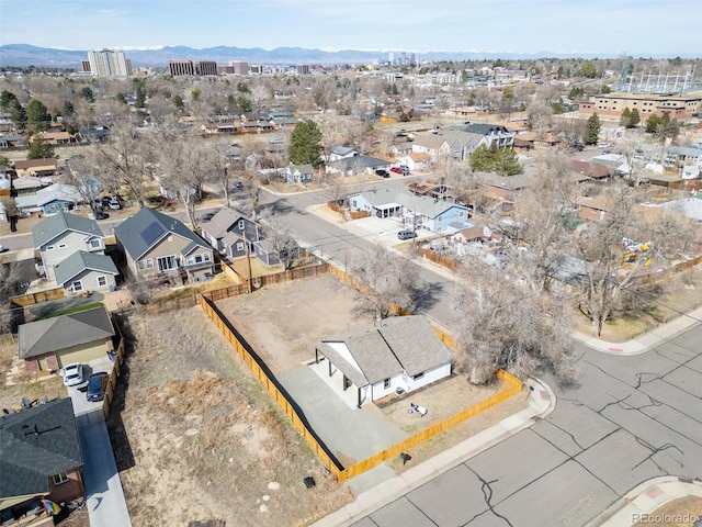 aerial view featuring a mountain view and a residential view