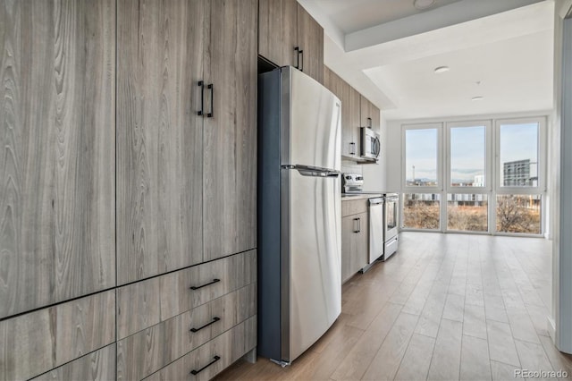 kitchen featuring light wood-type flooring and stainless steel appliances