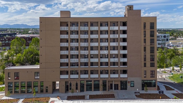 view of building exterior featuring a mountain view