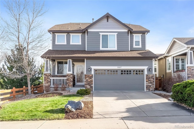 craftsman-style house featuring a porch, a front yard, and a garage