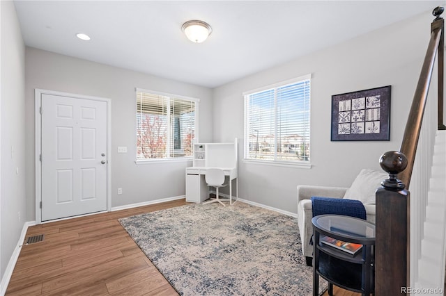 living area featuring hardwood / wood-style floors